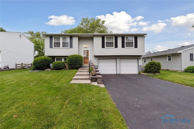 146 Partridge Ln, Perrysburg, OH 43551 - bi-level home with an attached garage and asphalt driveway