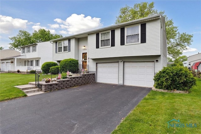 146 Partridge Ln, Perrysburg, OH 43551 - split foyer home with an attached garage, driveway, and a front yard