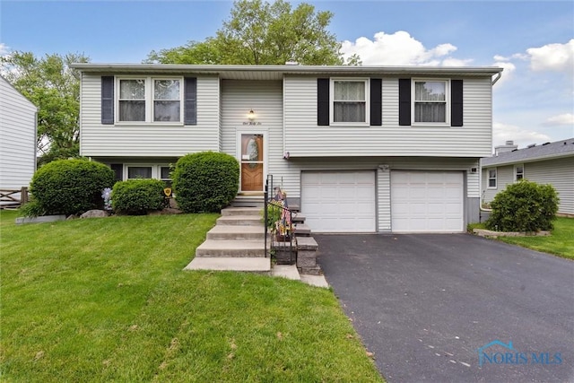 146 Partridge Ln, Perrysburg, OH 43551 - bi-level home with an attached garage, driveway, and a front yard