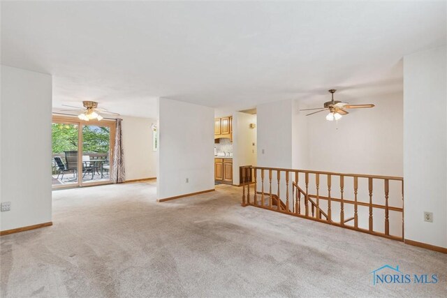 146 Partridge Ln, Perrysburg, OH 43551 - spare room featuring ceiling fan, light carpet, and baseboards