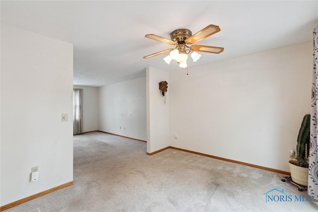 146 Partridge Ln, Perrysburg, OH 43551 - spare room with light carpet, a ceiling fan, and baseboards