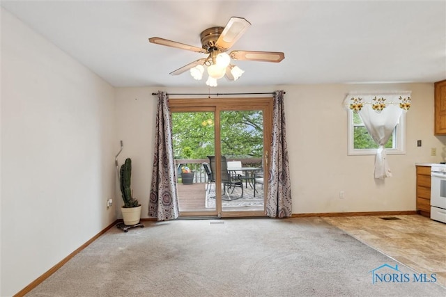 146 Partridge Ln, Perrysburg, OH 43551 - empty room with light carpet, baseboards, and a ceiling fan