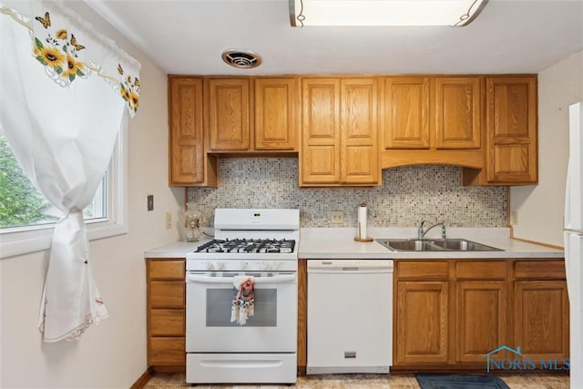 146 Partridge Ln, Perrysburg, OH 43551 - kitchen featuring white appliances, a sink, light countertops, and backsplash