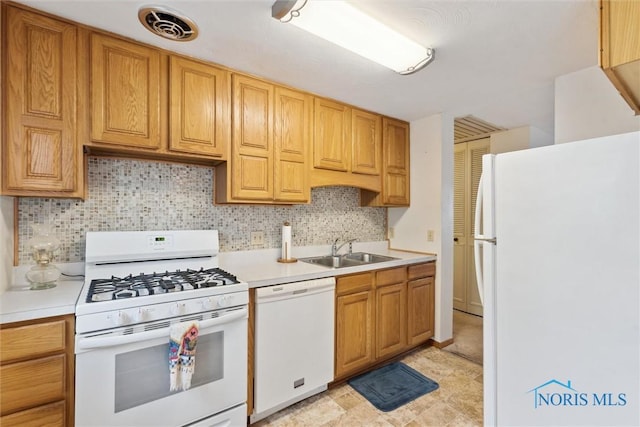 146 Partridge Ln, Perrysburg, OH 43551 - kitchen featuring white appliances, a sink, light countertops, and backsplash