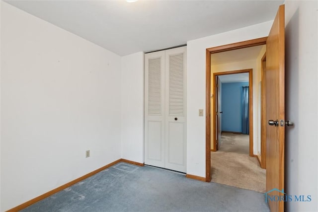 146 Partridge Ln, Perrysburg, OH 43551 - unfurnished bedroom featuring carpet floors, baseboards, and a closet