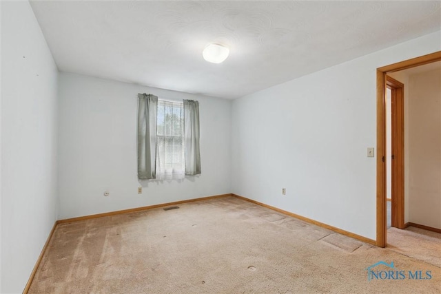 146 Partridge Ln, Perrysburg, OH 43551 - spare room featuring carpet floors and baseboards