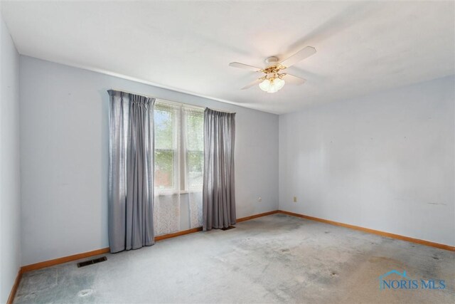 146 Partridge Ln, Perrysburg, OH 43551 - carpeted spare room with baseboards and a ceiling fan