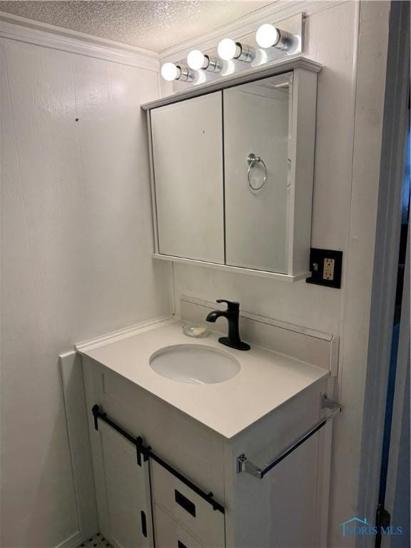 108 E Maple St, Deshler, OH 43516 - bathroom with vanity and a textured ceiling