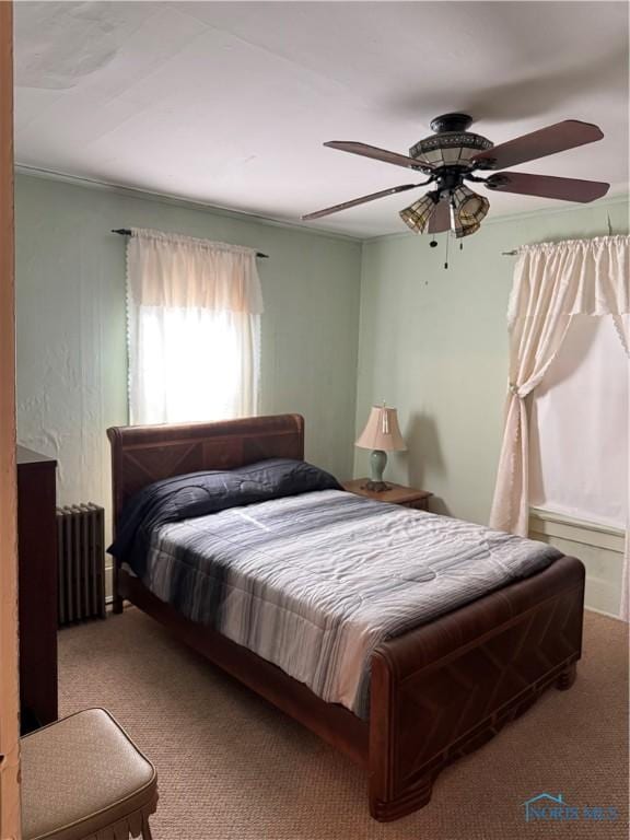 108 E Maple St, Deshler, OH 43516 - carpeted bedroom with radiator heating unit and ceiling fan