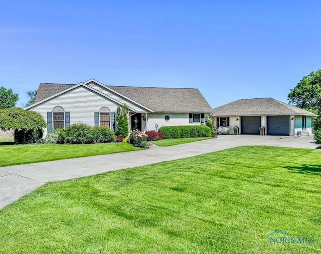 16070 Rd S, Columbus Grove, OH 45830 - ranch-style home featuring driveway, a front yard, and a garage