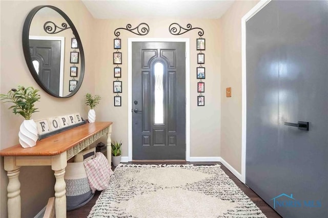 16070 Rd S, Columbus Grove, OH 45830 - foyer featuring baseboards and dark wood-type flooring