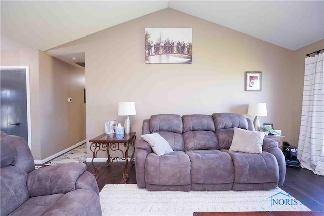 16070 Rd S, Columbus Grove, OH 45830 - living area featuring vaulted ceiling, wood finished floors, and baseboards