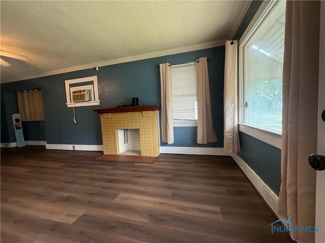 1726 Balkan Pl, Toledo, OH 43613 - unfurnished living room with a textured ceiling, crown molding, wood finished floors, a brick fireplace, and cooling unit