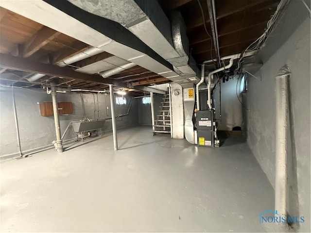 1726 Balkan Pl, Toledo, OH 43613 - basement with heating unit, a sink, and stairs