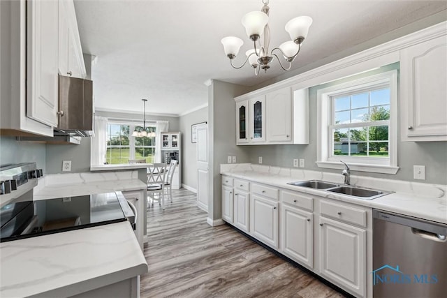 1250 Indiana Ave, Napoleon, OH 43545 - kitchen with stainless steel dishwasher, a sink, a chandelier, white cabinetry, and crown molding