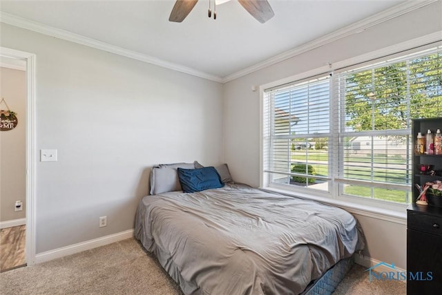 1250 Indiana Ave, Napoleon, OH 43545 - bedroom with baseboards, ornamental molding, a ceiling fan, and light colored carpet