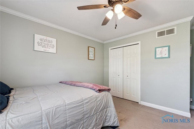 1250 Indiana Ave, Napoleon, OH 43545 - carpeted bedroom featuring crown molding, a closet, baseboards, and a ceiling fan