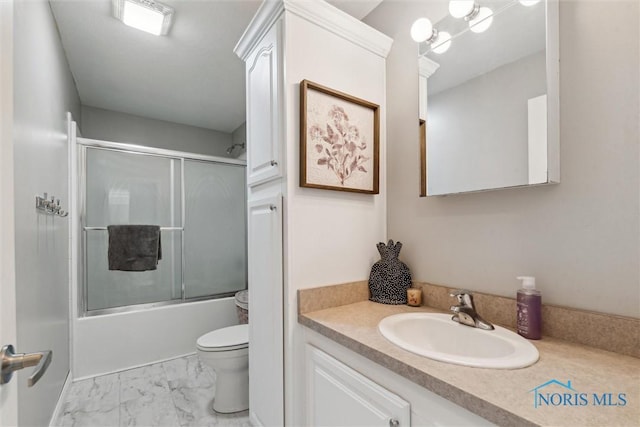 1250 Indiana Ave, Napoleon, OH 43545 - full bath featuring toilet, marble look tile flooring, vanity, and combined bath / shower with glass door