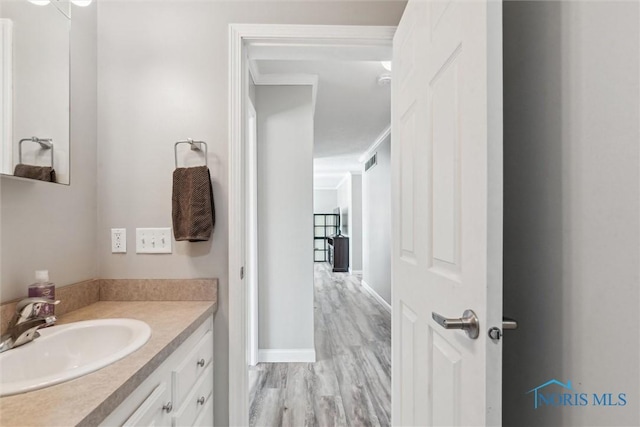 1250 Indiana Ave, Napoleon, OH 43545 - bathroom featuring vanity and wood finished floors