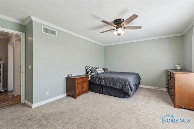 1250 Indiana Ave, Napoleon, OH 43545 - bedroom featuring ornamental molding, light carpet, baseboards, and a ceiling fan