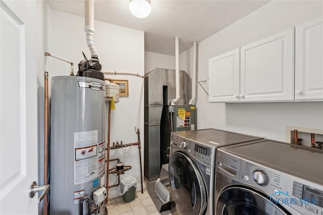 1250 Indiana Ave, Napoleon, OH 43545 - laundry area featuring gas water heater, cabinet space, and washing machine and dryer