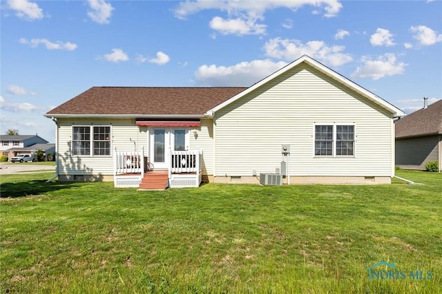 1250 Indiana Ave, Napoleon, OH 43545 - rear view of house featuring crawl space, a lawn, a wooden deck, and a shingled roof
