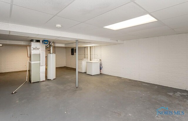 4022 Stonehenge Dr Unit 4022, Sylvania, OH 43560 - finished basement featuring gas water heater, a drop ceiling, heating unit, washer and dryer, and brick wall