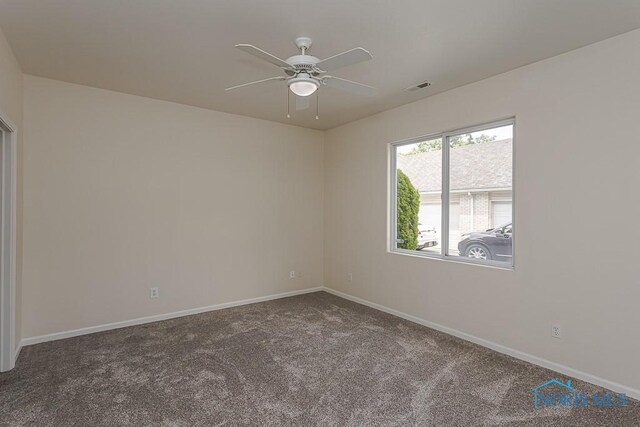 4022 Stonehenge Dr Unit 4022, Sylvania, OH 43560 - spare room with carpet floors, a ceiling fan, and baseboards