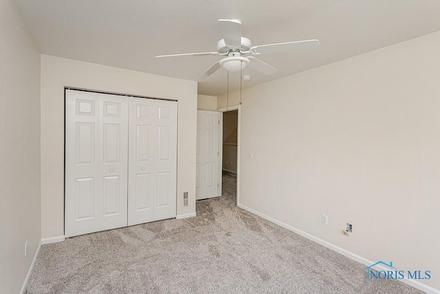 4022 Stonehenge Dr Unit 4022, Sylvania, OH 43560 - unfurnished bedroom with carpet floors, baseboards, a closet, and a ceiling fan
