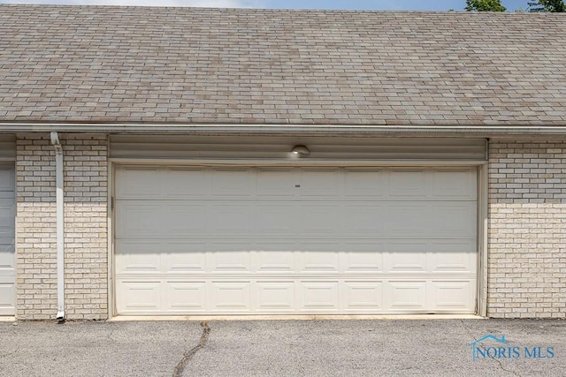 4022 Stonehenge Dr Unit 4022, Sylvania, OH 43560 - garage featuring driveway