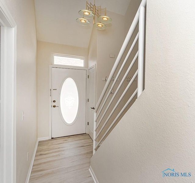 4022 Stonehenge Dr Unit 4022, Sylvania, OH 43560 - foyer entrance featuring light wood-style flooring, stairway, and baseboards