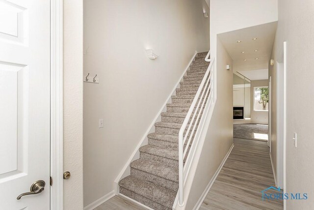 4022 Stonehenge Dr Unit 4022, Sylvania, OH 43560 - staircase with wood finished floors and baseboards