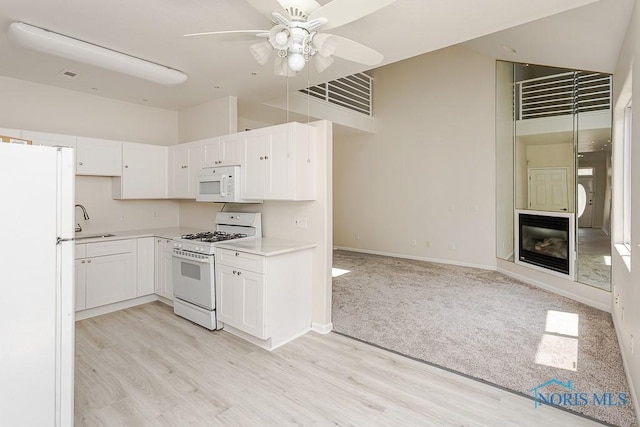 4022 Stonehenge Dr Unit 4022, Sylvania, OH 43560 - kitchen with white appliances, a sink, ceiling fan, and light wood-style flooring