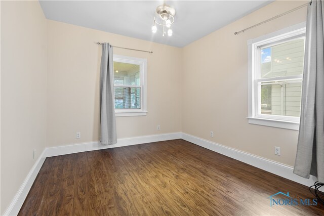 1006 Woodward Ave, Toledo, OH 43608 - spare room with wood finished floors and baseboards
