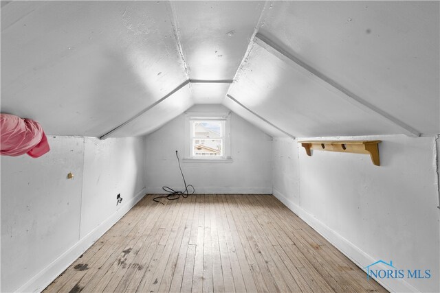 1006 Woodward Ave, Toledo, OH 43608 - additional living space featuring hardwood / wood-style flooring, lofted ceiling, and baseboards