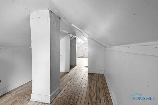 1006 Woodward Ave, Toledo, OH 43608 - bonus room featuring vaulted ceiling, hardwood / wood-style flooring, and baseboards