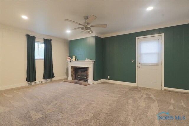 1006 Woodward Ave, Toledo, OH 43608 - unfurnished living room with a ceiling fan, a fireplace, carpet floors, ornamental molding, and baseboards