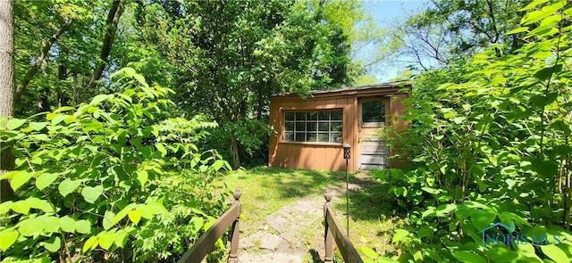 5806 Elmer Dr, Toledo, OH 43615 - view of yard with a vegetable garden and an outdoor structure