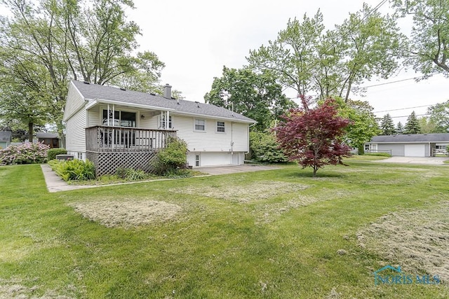 1201 Birch Ave, Maumee, OH 43537 - rear view of house with a chimney, a lawn, a wooden deck, and an attached garage