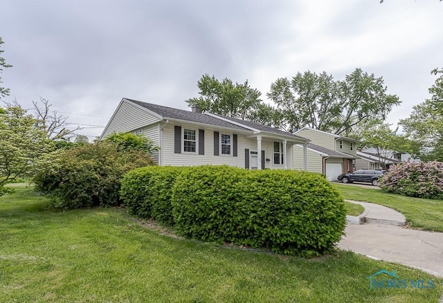 1201 Birch Ave, Maumee, OH 43537 - view of front of home featuring a garage and a front lawn