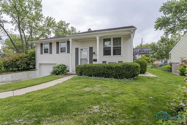 1201 Birch Ave, Maumee, OH 43537 - bi-level home featuring an attached garage and a front lawn