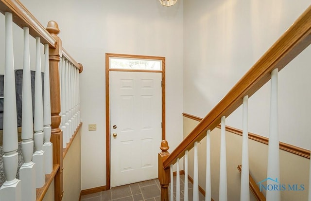 1201 Birch Ave, Maumee, OH 43537 - entryway with stairs, baseboards, and dark tile patterned floors