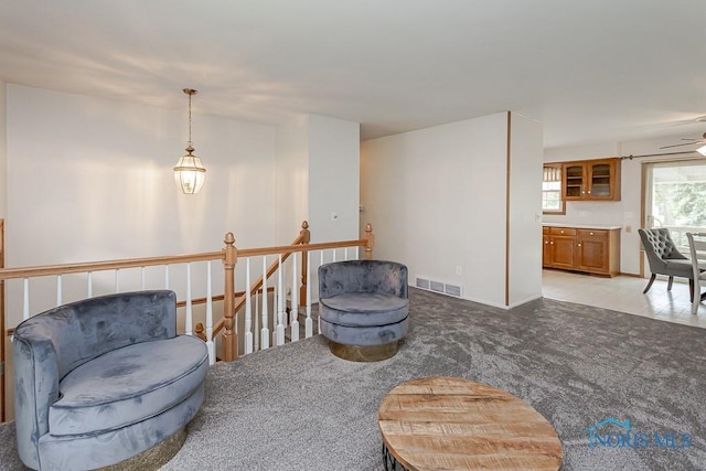 1201 Birch Ave, Maumee, OH 43537 - sitting room featuring an upstairs landing, light colored carpet, and ceiling fan