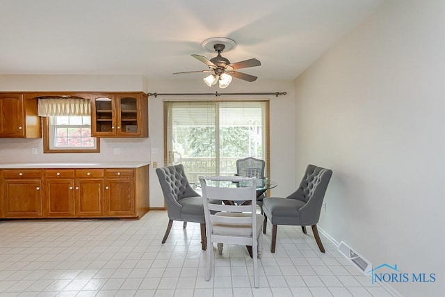 1201 Birch Ave, Maumee, OH 43537 - dining area with ceiling fan and baseboards