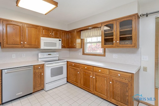 1201 Birch Ave, Maumee, OH 43537 - kitchen featuring white appliances, brown cabinets, and light countertops