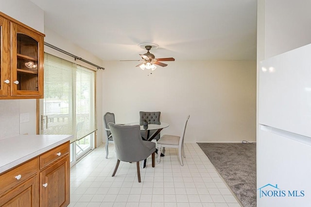 1201 Birch Ave, Maumee, OH 43537 - dining space with a ceiling fan and light colored carpet