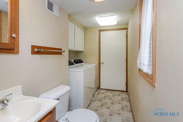 1201 Birch Ave, Maumee, OH 43537 - bathroom featuring washer and dryer, toilet, and vanity