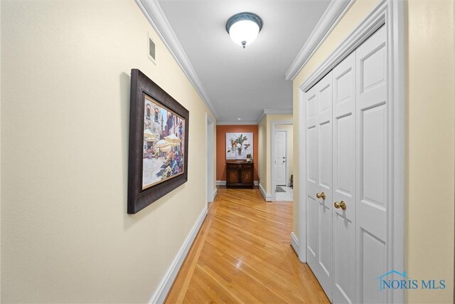 26741 Green Ville Dr, Perrysburg, OH 43551 - hallway featuring crown molding, light wood finished floors, and baseboards