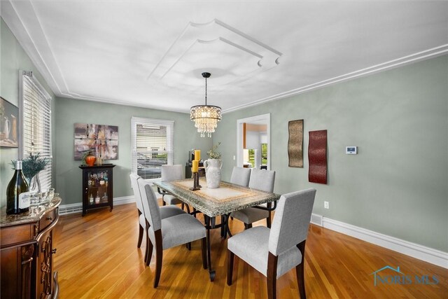 26741 Green Ville Dr, Perrysburg, OH 43551 - dining space featuring a chandelier, light wood-type flooring, and baseboards