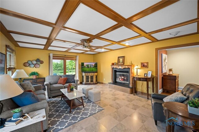 26741 Green Ville Dr, Perrysburg, OH 43551 - living room with coffered ceiling, a ceiling fan, a glass covered fireplace, and baseboards